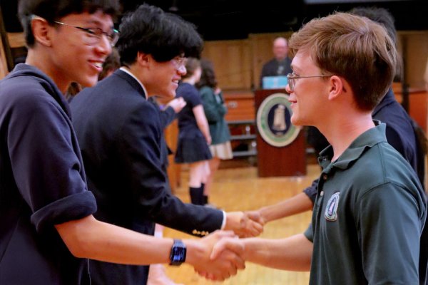 Two Doane Stuart students shaking hands